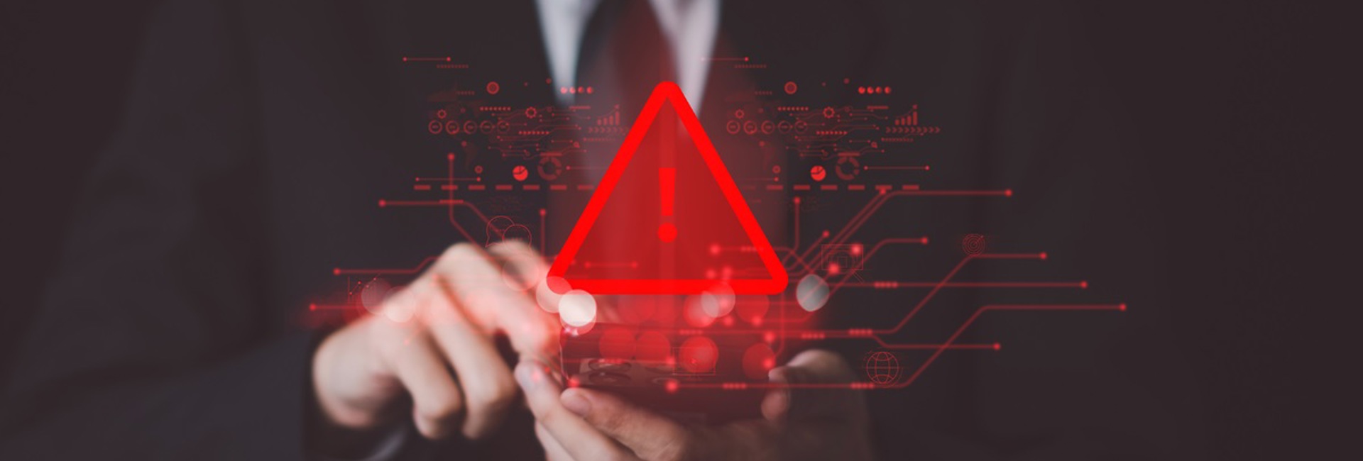 Business man touching a device alerting there has been a breach and IT incident response plan needs to be put into action