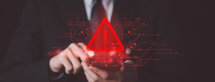 Business man touching a device alerting there has been a breach and IT incident response plan needs to be put into action